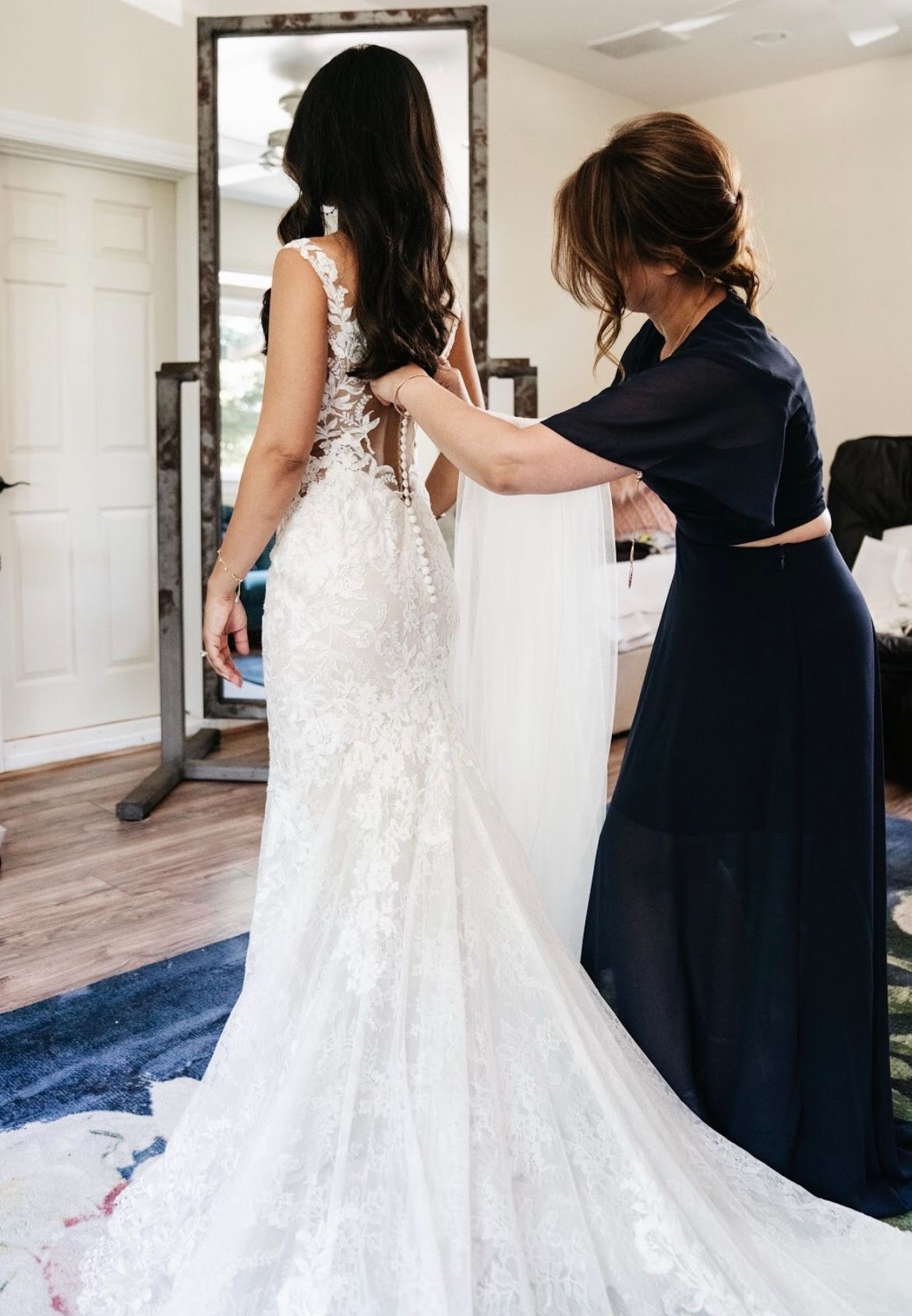 Bridal gown fitting — lace and bespoke tailoring